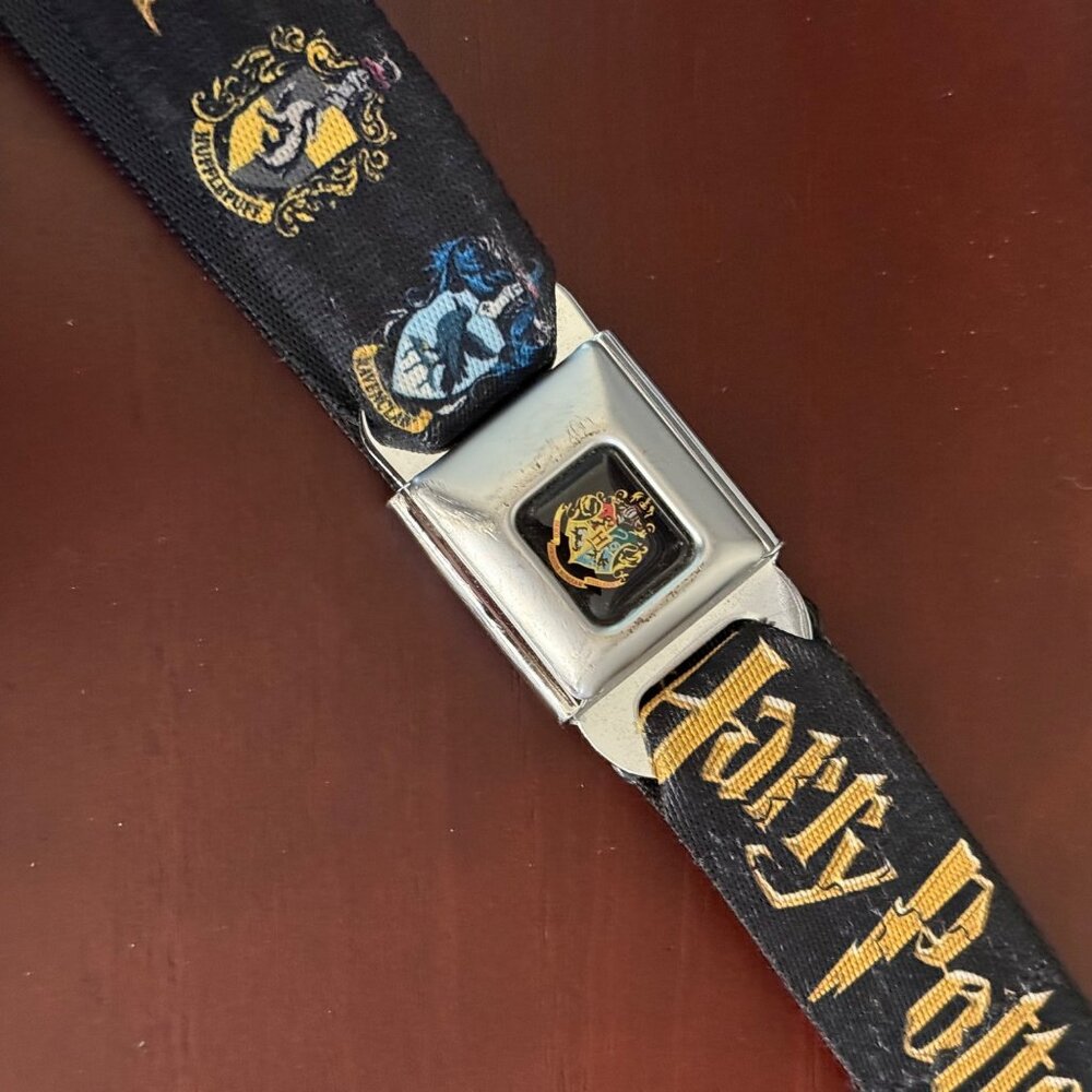 Buckle-Down Harry Potter Seatbelt Belt With Hogwarts House Crests & Logo Design